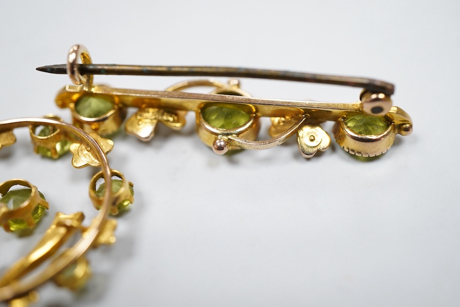 Two Edwardian peridot and seed pearl jewels, early 20th century, comprising: a bar brooch and a pendant, each of foliate design, set with circular-cut peridots and seed pearls, mounted in gold, brooch length 3.5cm, maker